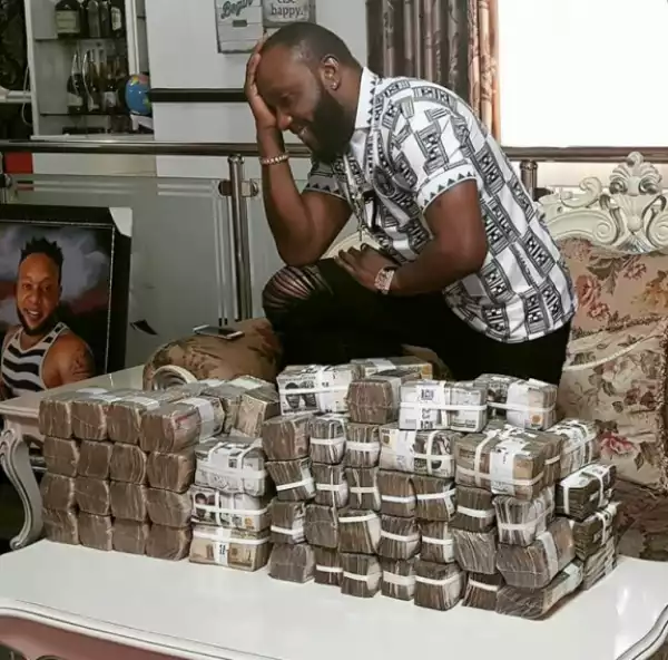 Kcee Poses With Bundles Of Money On His Table (Photo)